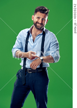 Handsome businessman checking his wrist-watch Isolated on white background 40939242