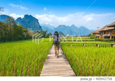 Tourism with backpack walking on wooden path 40942756