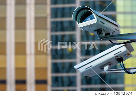 security CCTV camera with buildings on background security CCTV camera with buildings on background 40942974