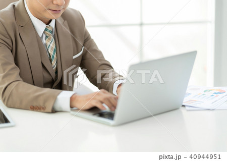 Experienced businessman sitting work on laptop. 40944951