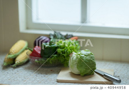 Fresh vegetable and fruit near the window. 40944958