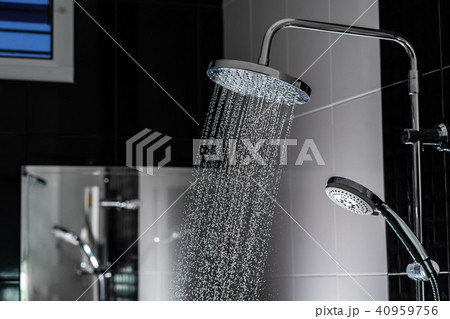 Water flowing from shower in the bathroom 40959756