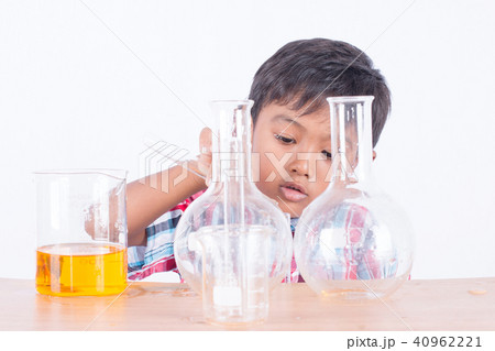 Cute little boy doing science experiment 40962221