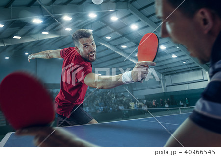 The table tennis player serving The table tennis player serving 40966545