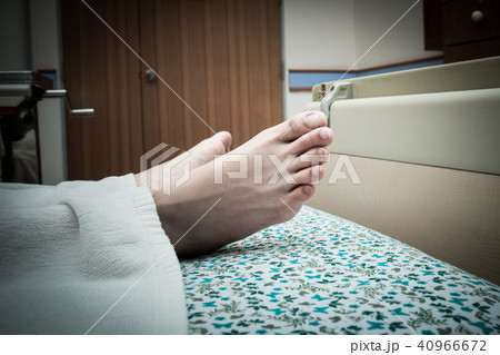 Feet of a dying patient lying on a mobile bed Feet of a dying patient lying on a mobile bed 40966672