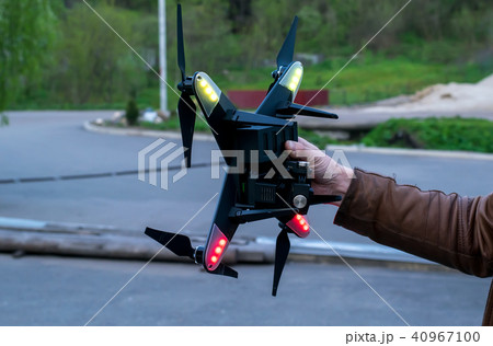 quadrocopter in the hand of a man quadrocopter in the hand of a man 40967100