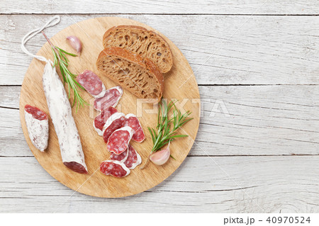 Sliced salami on cutting board 40970524