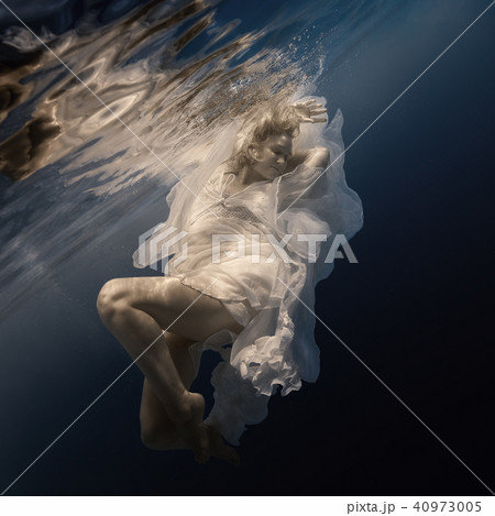 Woman in white dress under water Woman in white dress under water 40973005