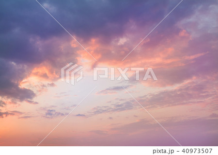 Colorful vibrant dramatic sky with purple to orange clouds. Sunset time. Beautiful nature background Colorful vibrant dramatic sky with purple to orange clouds. Sunset time. Beautiful nature background 40973507