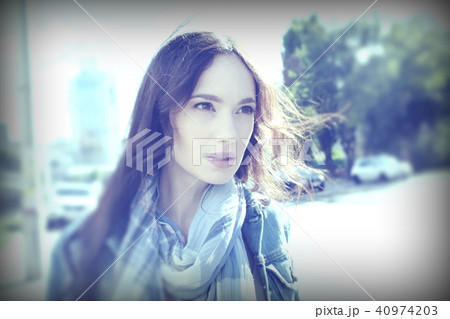 Street portrait of a young woman in wind 40974203