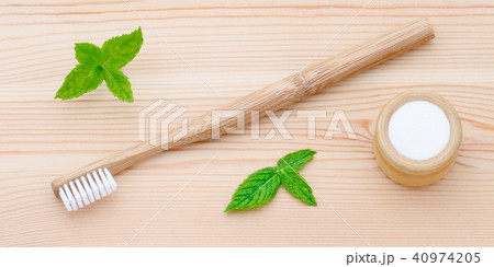 wood toothbrush and xylitol, soda, powder, salt, mint on wooden 40974205