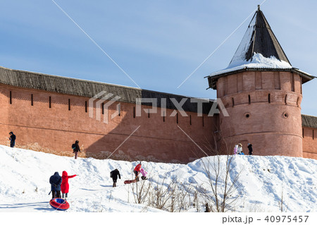 snow slope of riverbank near wall of Monastery snow slope of riverbank near wall of Monastery 40975457