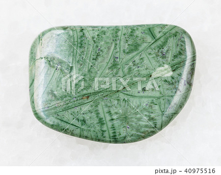 polished Tinguaite gemstone on white polished Tinguaite gemstone on white 40975516