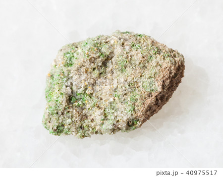 green Pintadoite crystals in raw stone on white green Pintadoite crystals in raw stone on white 40975517