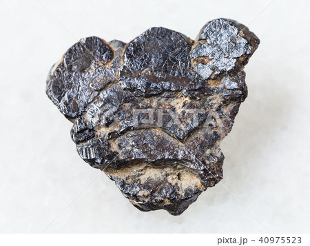 raw Ilmenite stone on white raw Ilmenite stone on white 40975523