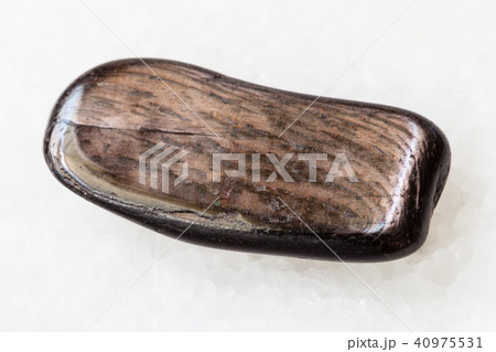 polished Hypersthene stone on white 40975531