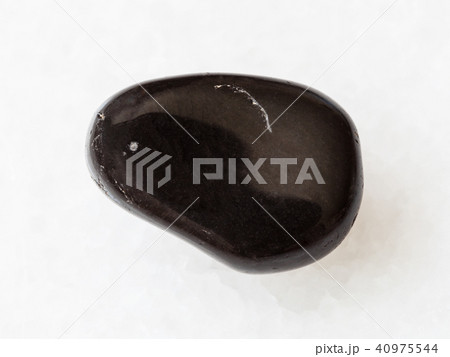 polished black obsidian gem stone on white 40975544