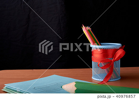 School and office supplies on classroom table 40976857