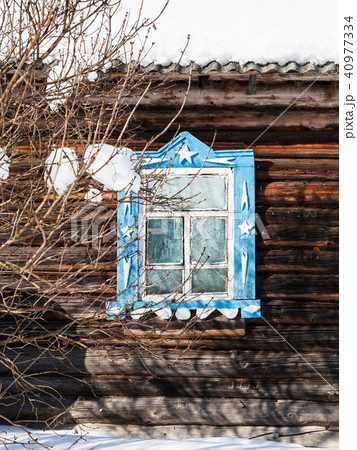 carved window in wooden wall of old rural house 40977334