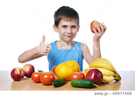 Happy healthy boy with fruits and vegetables 40977408