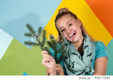 Cheerful woman with fir branches Cheerful woman with fir branches 40977994