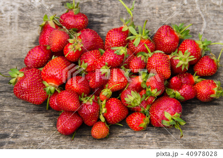 Ripe fresh strawberries on wooden background 40978028