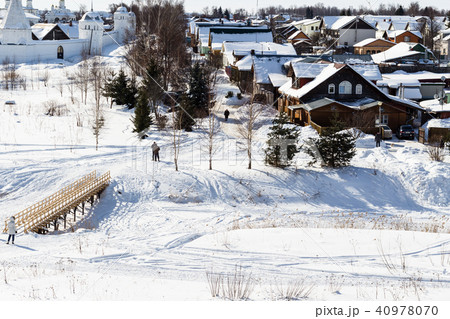 houses and Monastery near frozen river in Suzdal 40978070