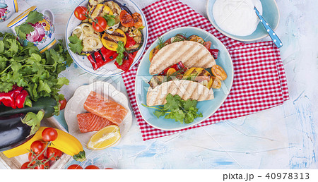 Mexican tacos with grilled vegetables and salmon. Healthy food for lunch. Fast food. Copy space 40978313