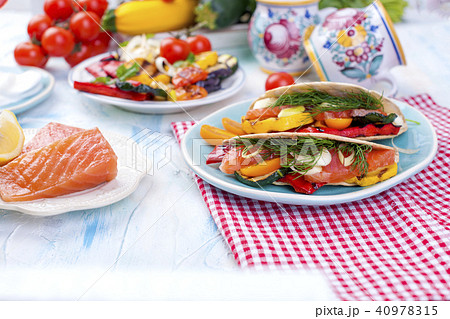 Mexican tacos with grilled vegetables and salmon. Healthy food for lunch. Fast food. Copy space 40978315