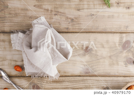 Gray textile napkin on a wooden table. place for text. Copy space. Flat lay 40979170