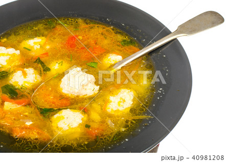 Soup with carrot, onion, paprika and meatballs Soup with carrot, onion, paprika and meatballs 40981208
