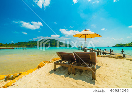 Beautiful tropical beach and sea with coconut palm tree in paradise island Beautiful tropical beach and sea with coconut palm tree in paradise island 40984246