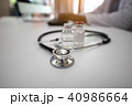 Stethoscope with Doctor working on desk computer 40986664