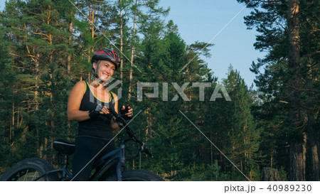 Fat bike also called fatbike or fat-tire bike in summer riding in the forest. 40989230