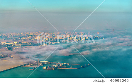 Aerial view of Doha through the morning fog - Qatar, the Persian Gulf Aerial view of Doha through the morning fog - Qatar, the Persian Gulf 40995046