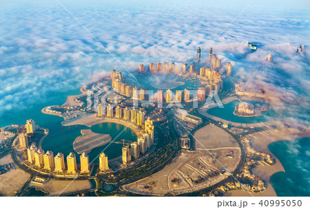 Aerial view of the Pearl-Qatar island in Doha through the morning fog - Qatar, the Persian Gulf Aerial view of the Pearl-Qatar island in Doha through the morning fog - Qatar, the Persian Gulf 40995050