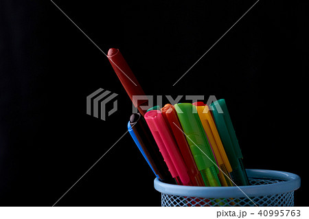 Color Magic in a metal box on a black background. Color Magic in a metal box on a black background. 40995763