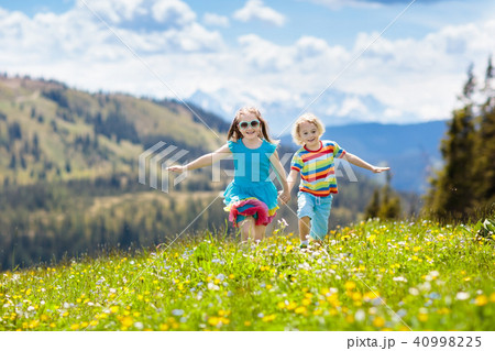 Children hiking in Alps mountains. Kids outdoor. Children hiking in Alps mountains. Kids outdoor. 40998225