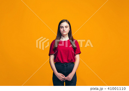 Young serious thoughtful teen girl. Doubt concept. 41001110
