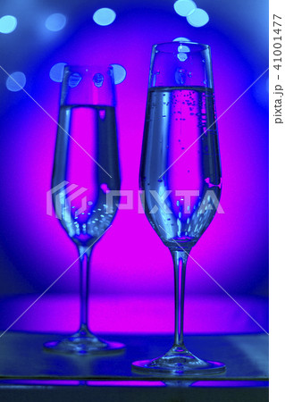 Champagne glasses in disco party bar 41001477