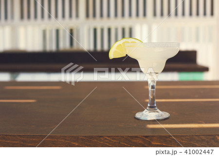 Cocktail glass on outdoor bar counter 41002447