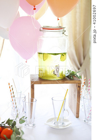 Citrus homemade lemonade in a beverage dispencer 41002697