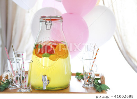 Citrus homemade lemonade in a beverage dispencer 41002699