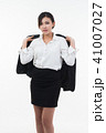 Business woman posing on whiteboard on white  41007027
