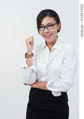 Business woman posing on whiteboard on white  41007029