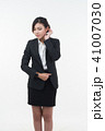 Business woman posing on whiteboard on white 41007030