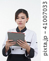 portrait of asia clef woman with tablet on white  41007033