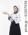 portrait of asia clef woman with food on white 41007036