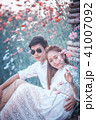 Asia loving couple in blossom spring garden 41007092
