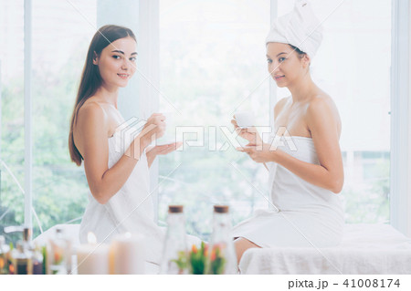 Two women drinking tea in luxury day spa. 41008174